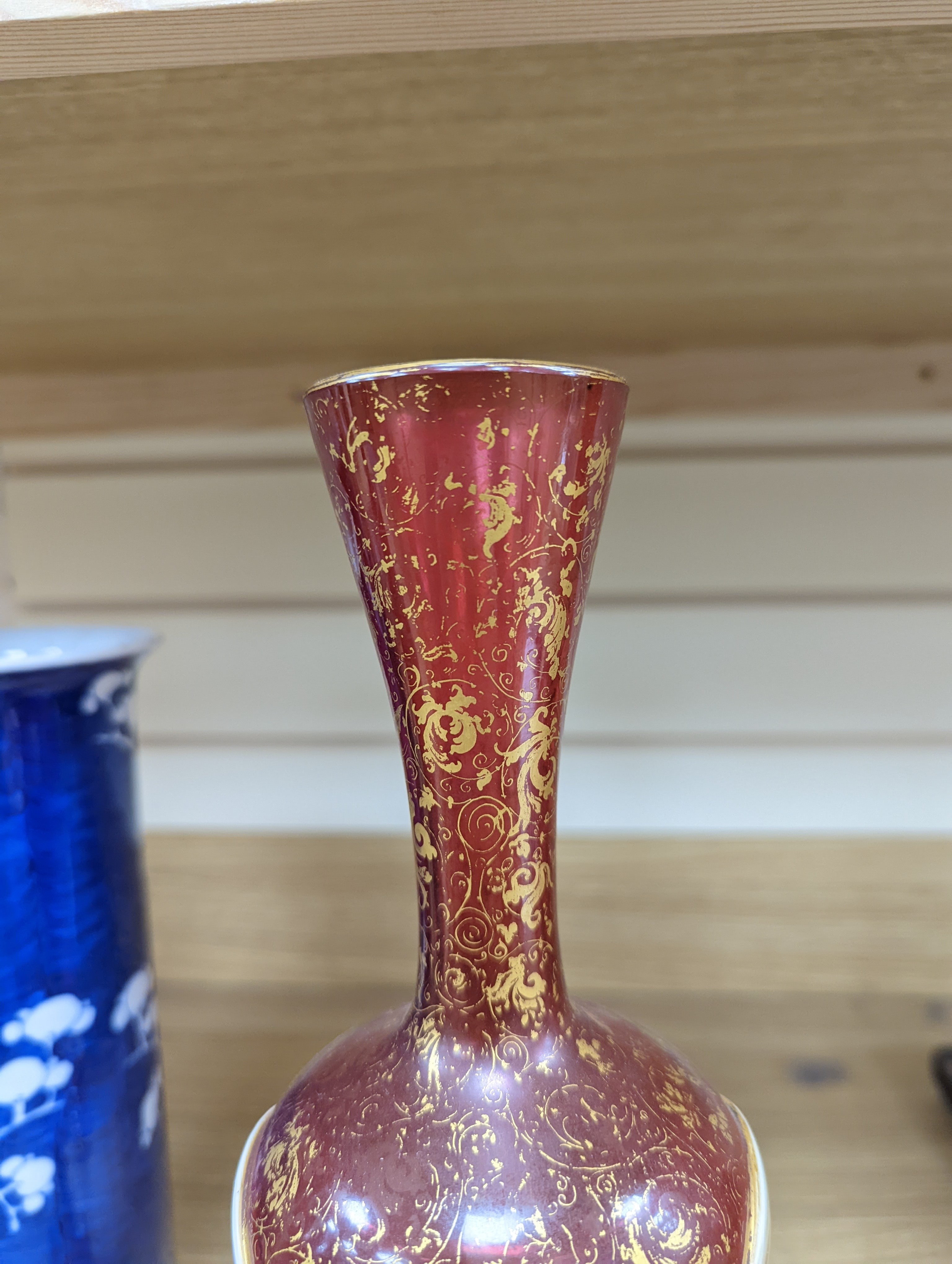A pair of 19th century Bohemian enamelled and overlaid ruby glass vases 36cm